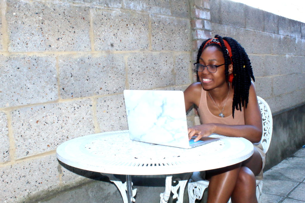 girl smiling at laptop