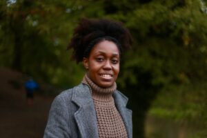 girl with afro smiling