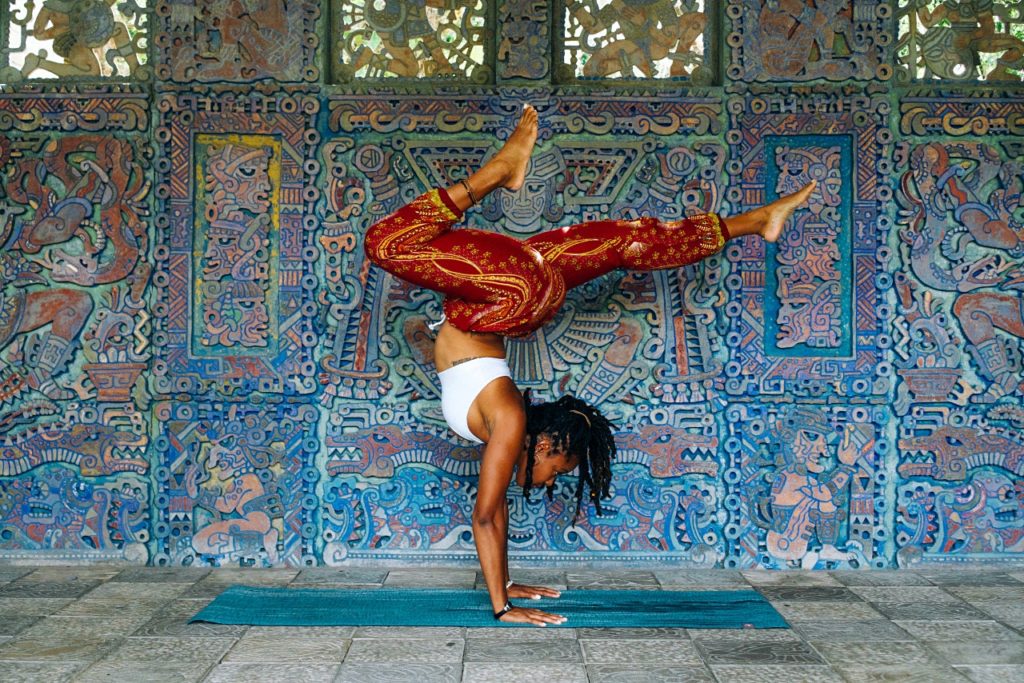 how to avoid burnout: girl excersising on yoga mat