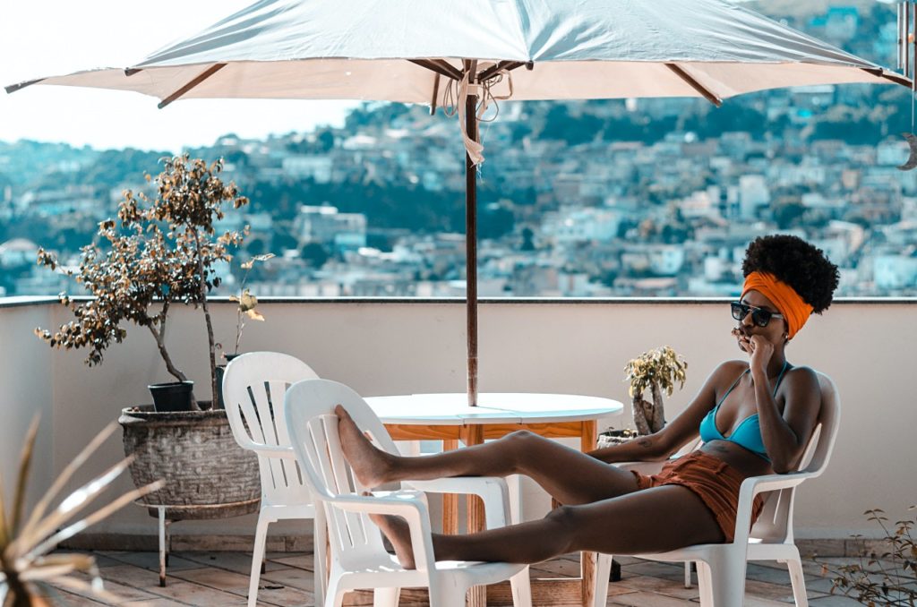 how to avoid burnout: girl relaxing on chair for holiday