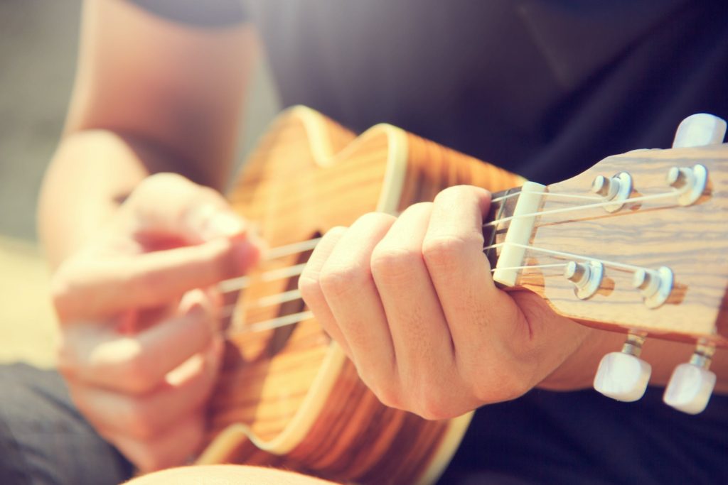 a man playing a guitar